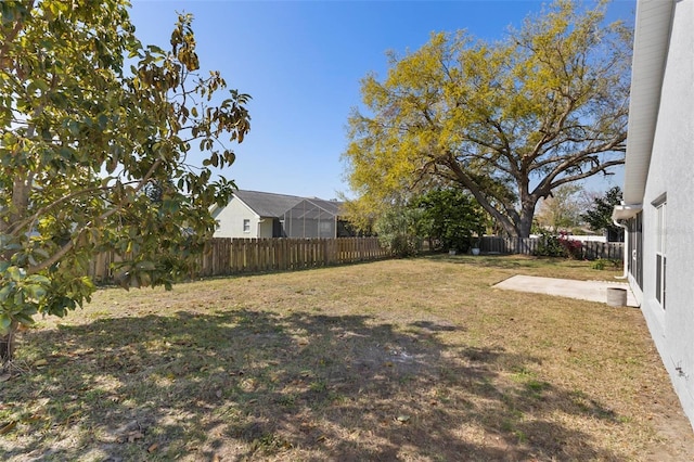 view of yard featuring a fenced backyard and a patio