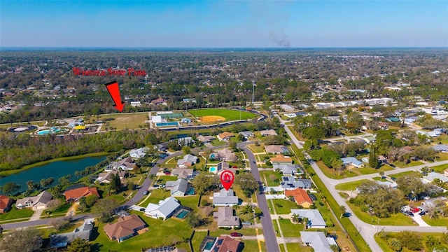 birds eye view of property featuring a water view and a residential view