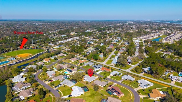 birds eye view of property featuring a water view and a residential view