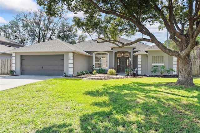 ranch-style home featuring a garage and a front yard