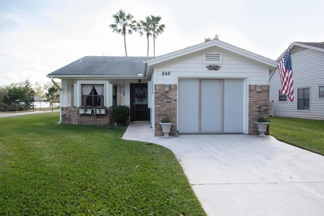 view of front facade with a garage and a front yard