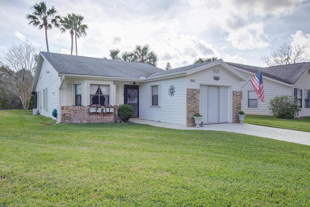 ranch-style house featuring a garage and a front lawn