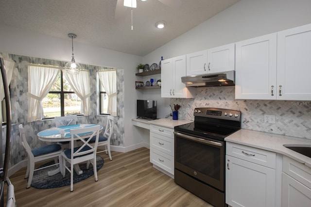 kitchen featuring white cabinetry, backsplash, vaulted ceiling, stainless steel range with electric cooktop, and light wood-type flooring