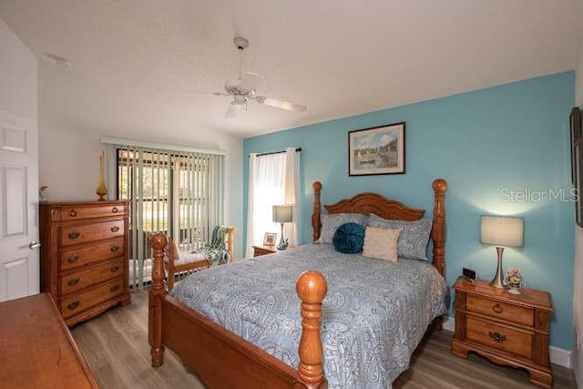 bedroom featuring hardwood / wood-style floors and ceiling fan