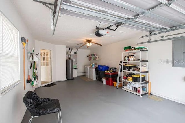 garage with a garage door opener, gas water heater, and electric panel