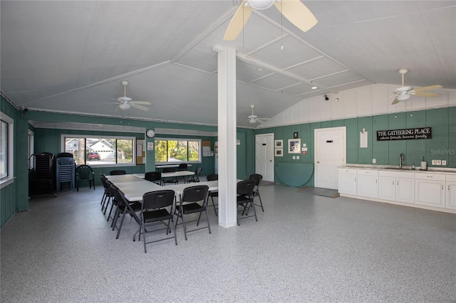 dining area with vaulted ceiling, ceiling fan, and sink