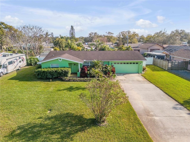 single story home with a garage and a front yard