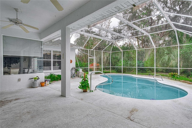 view of swimming pool featuring a patio and a lanai