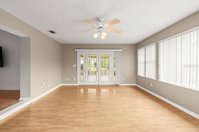 unfurnished room with ceiling fan and light hardwood / wood-style flooring