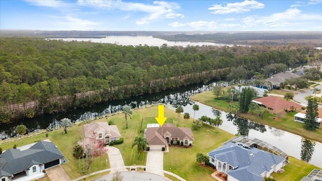 birds eye view of property with a water view