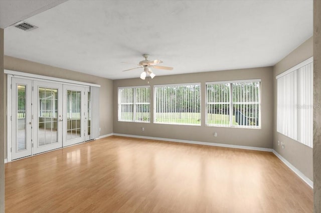 interior space featuring light hardwood / wood-style floors, french doors, and ceiling fan