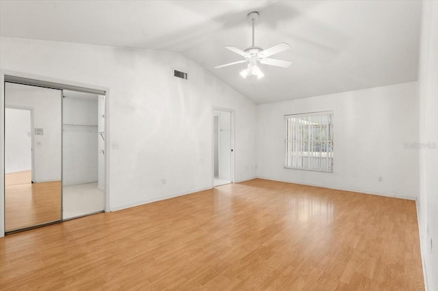 unfurnished bedroom with light hardwood / wood-style flooring, ceiling fan, and vaulted ceiling