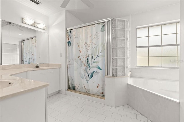 bathroom with ceiling fan, vanity, and plus walk in shower