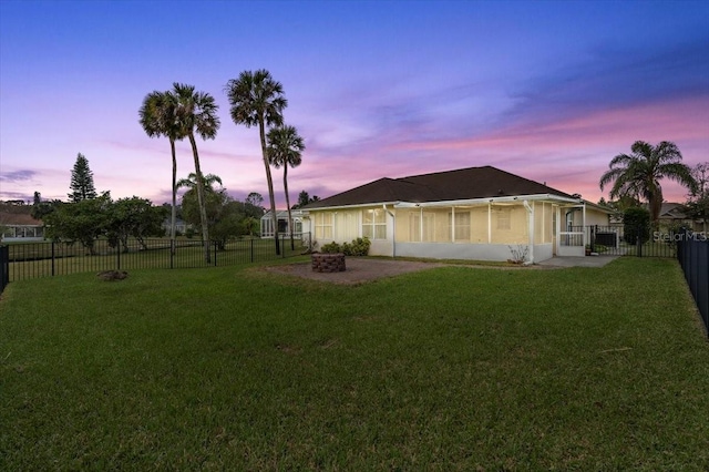 view of yard at dusk