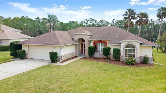 view of front of property featuring a garage and a front lawn