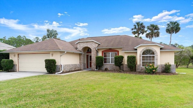 single story home featuring a garage and a front lawn