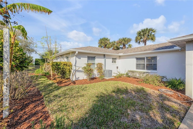 single story home featuring central AC and a front lawn