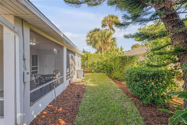 view of yard featuring a sunroom