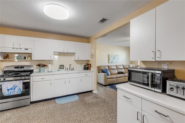 kitchen featuring white cabinetry, appliances with stainless steel finishes, sink, and a textured ceiling