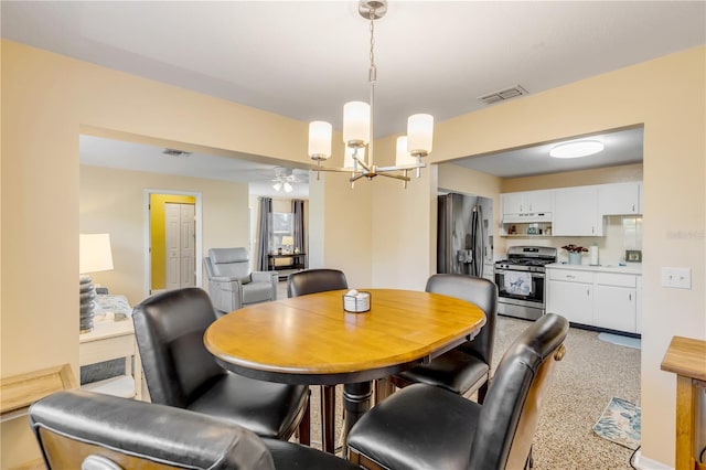 dining area with a notable chandelier