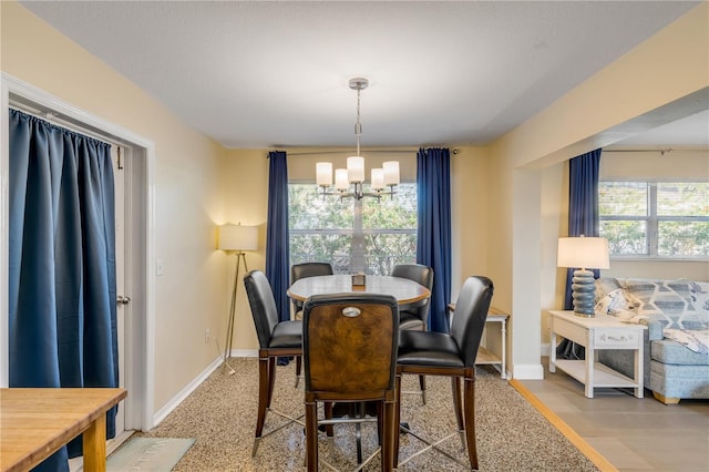 dining area with a notable chandelier