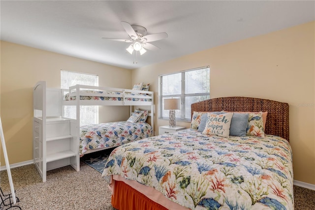 bedroom featuring ceiling fan and carpet