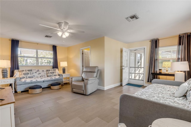 bedroom featuring multiple windows and ceiling fan