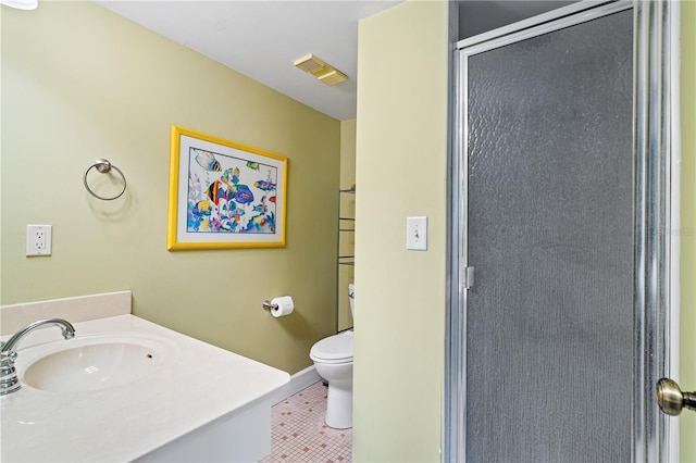 bathroom with tile patterned flooring, toilet, vanity, and a shower with shower door