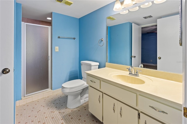 bathroom featuring tile patterned floors, vanity, toilet, and an enclosed shower