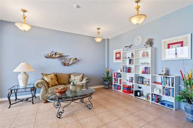 living room featuring tile patterned floors and a textured ceiling