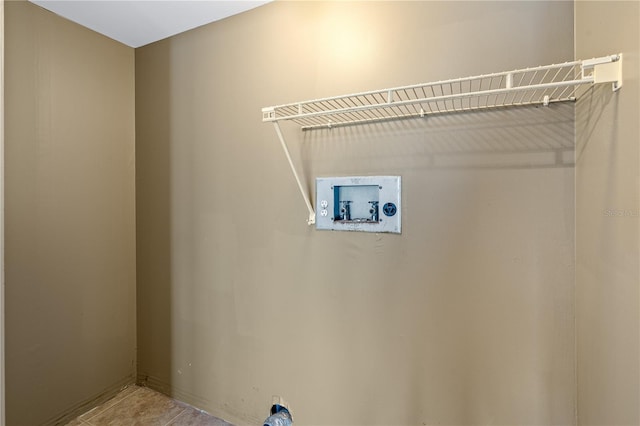 laundry area with hookup for a washing machine and tile patterned flooring