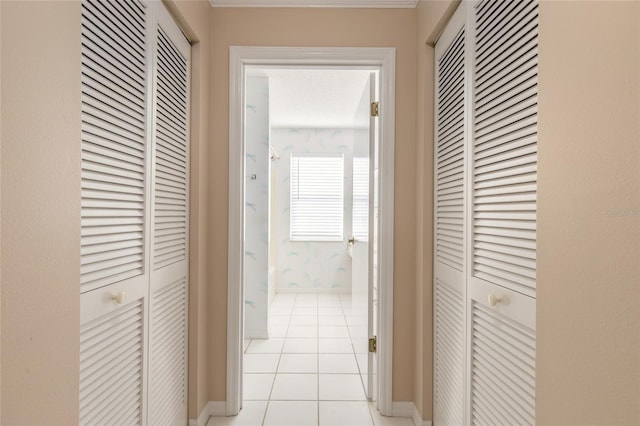 corridor with light tile patterned flooring