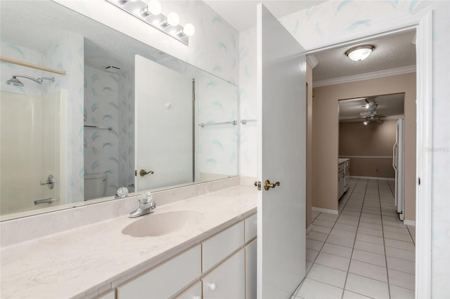 full bathroom featuring tile patterned flooring, vanity, ornamental molding, a textured ceiling, and toilet