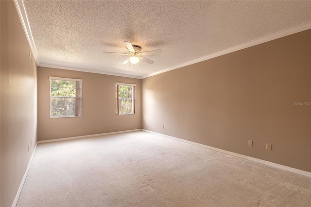 carpeted empty room with crown molding, a textured ceiling, and ceiling fan