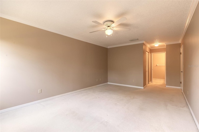 carpeted spare room with crown molding, a textured ceiling, and ceiling fan