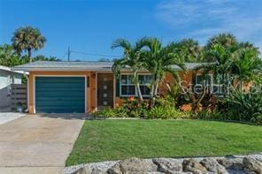 view of front facade featuring a garage and a front yard