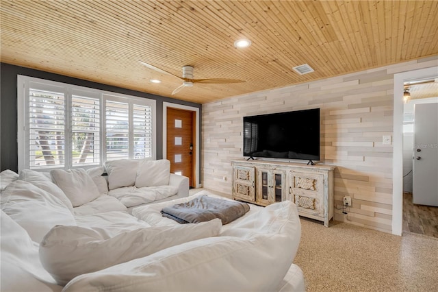 living area featuring recessed lighting, wooden ceiling, wood walls, and ceiling fan