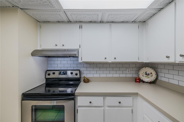 kitchen featuring white cabinetry, stainless steel electric range oven, and decorative backsplash