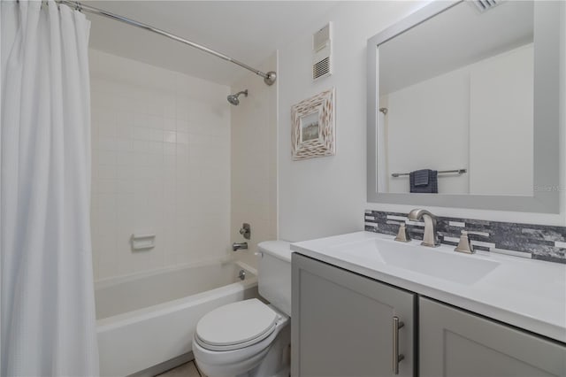 full bathroom featuring shower / tub combo with curtain, vanity, and toilet