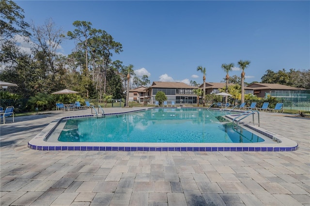 view of swimming pool featuring a patio area