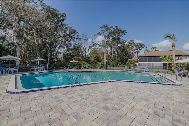 view of swimming pool with a patio area