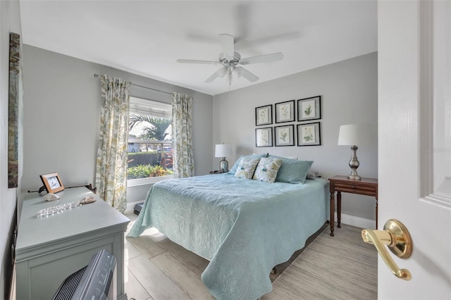 bedroom featuring ceiling fan and light hardwood / wood-style floors