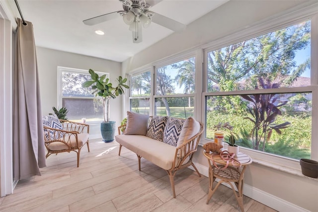 sunroom / solarium with ceiling fan