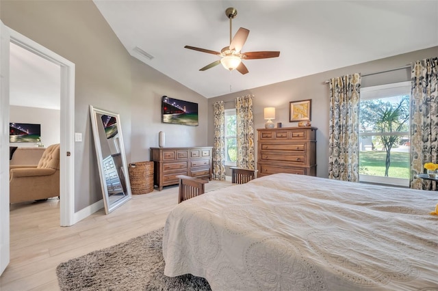 bedroom featuring ceiling fan, lofted ceiling, and light hardwood / wood-style flooring