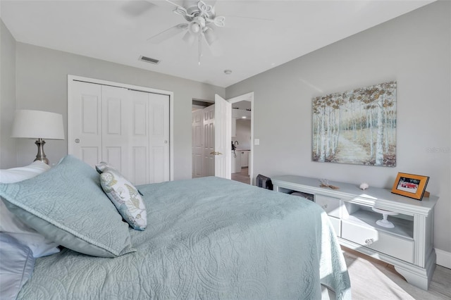 bedroom featuring a closet, visible vents, ceiling fan, and baseboards