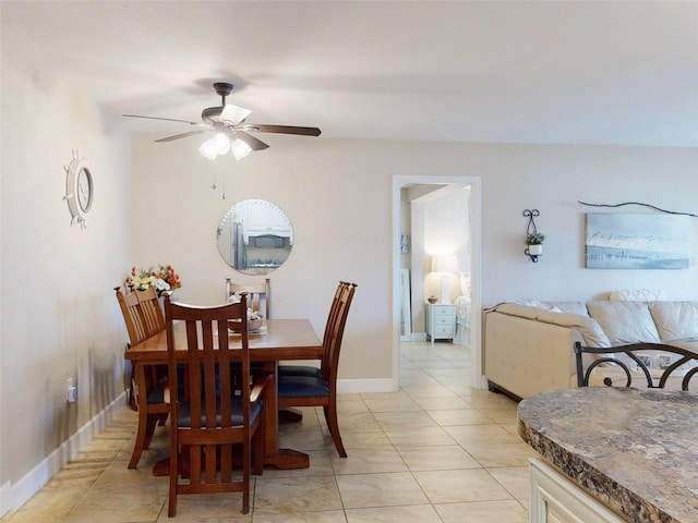 dining room with light tile patterned flooring and ceiling fan