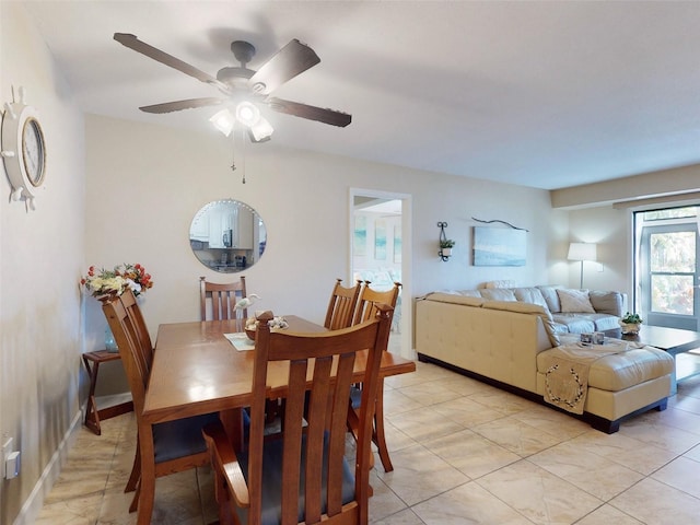 dining space featuring ceiling fan