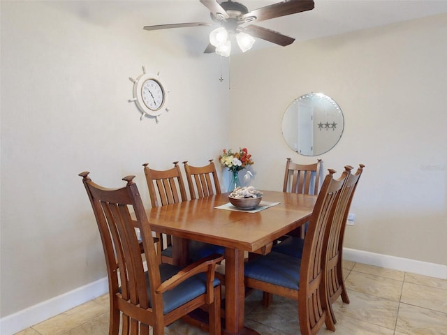 tiled dining room with ceiling fan