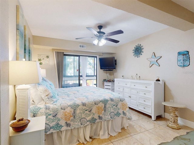 tiled bedroom with ceiling fan and access to exterior