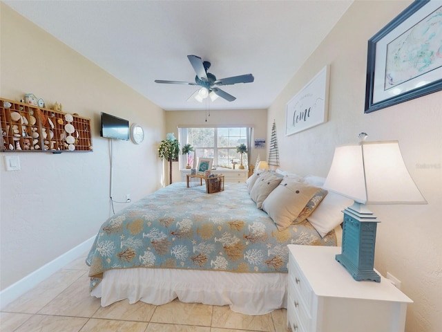 bedroom with light tile patterned floors and ceiling fan